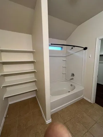 a bathroom with a granite countertop sink a toilet and a mirror