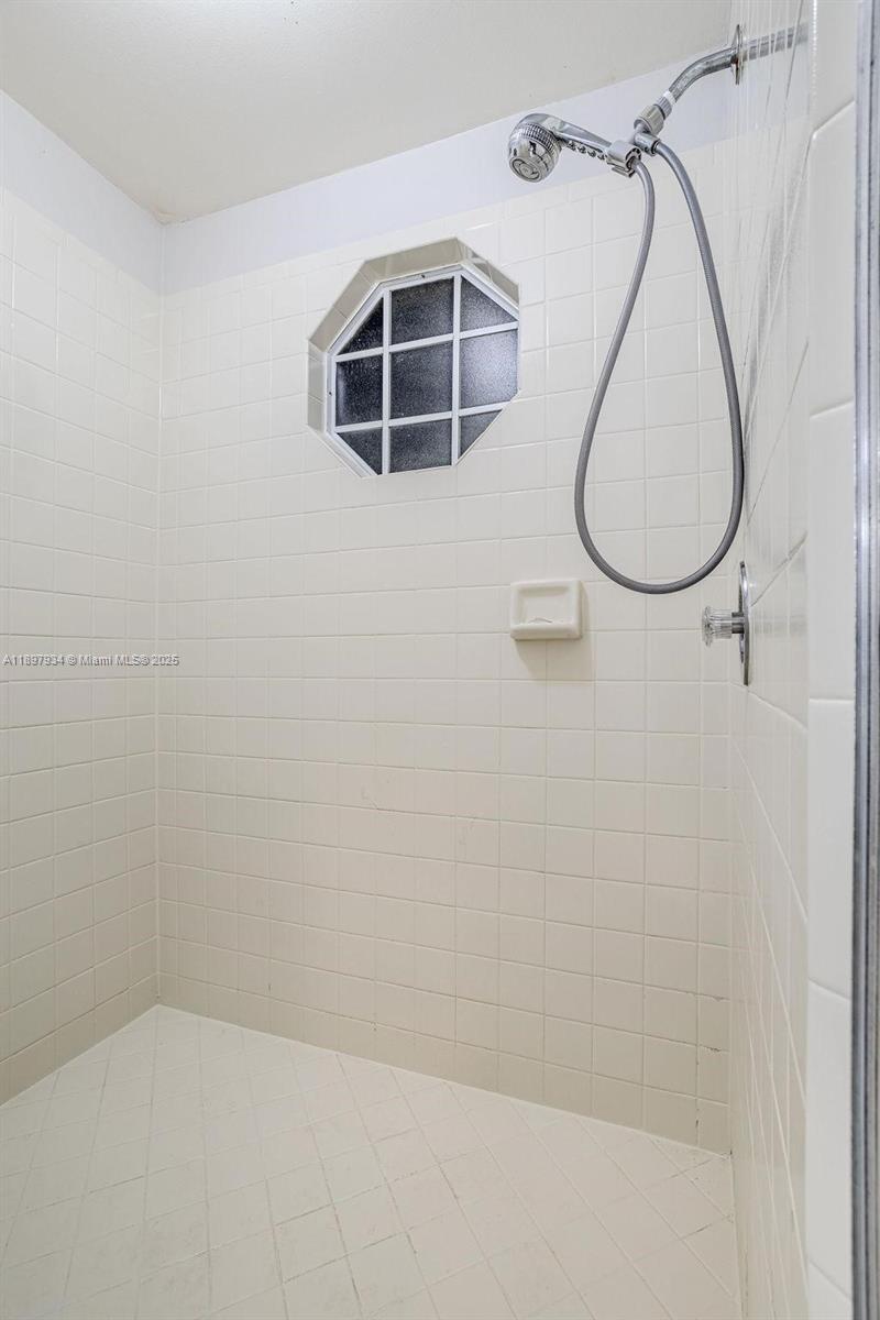 6500 Via Regina, Unit 8 Boca Raton, FL 33433 - Photo 16 of 31 a bathroom with a shower