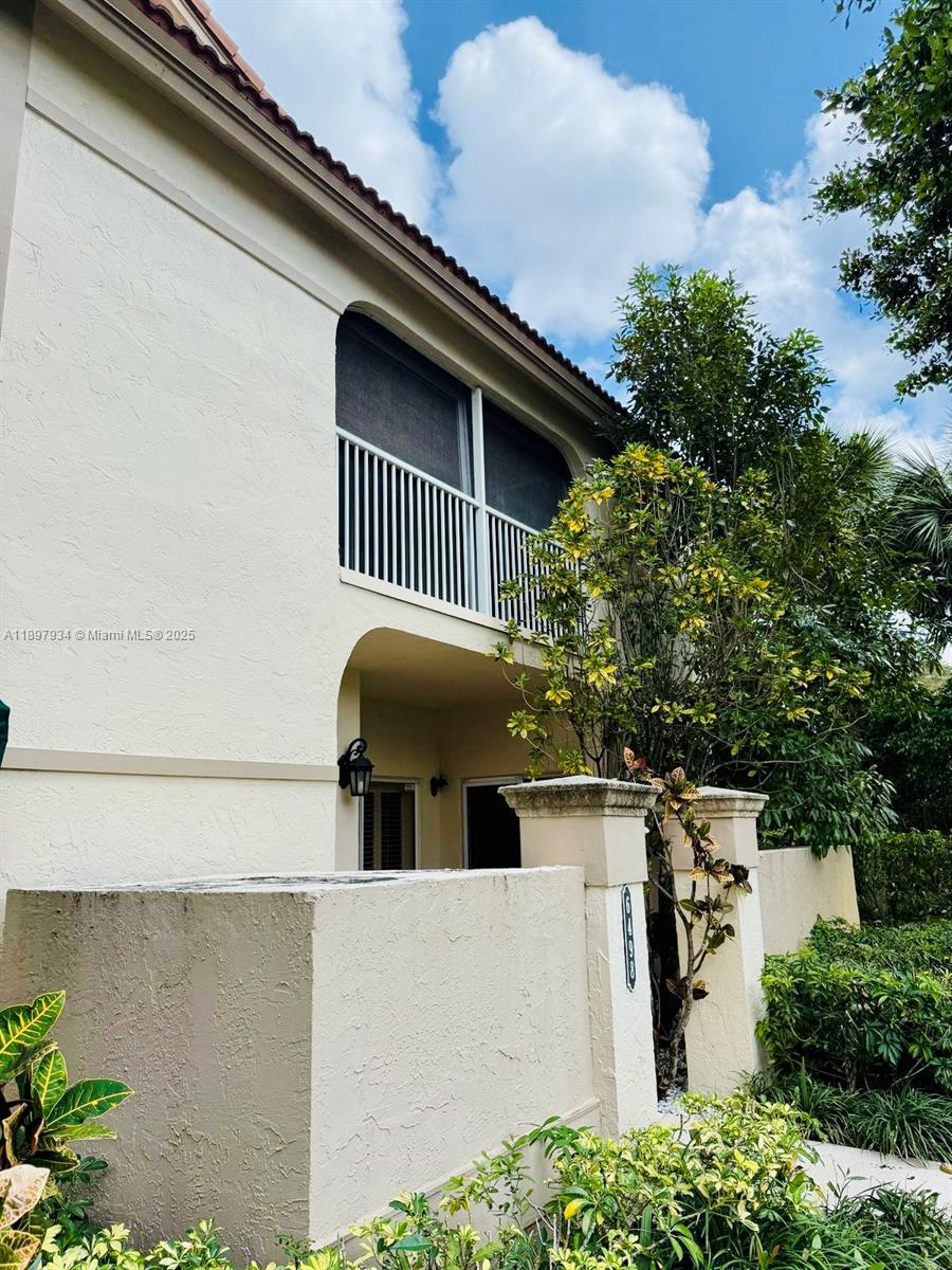 6500 Via Regina, Unit 8 Boca Raton, FL 33433 - Photo 25 of 31 a view of a house with a large windows