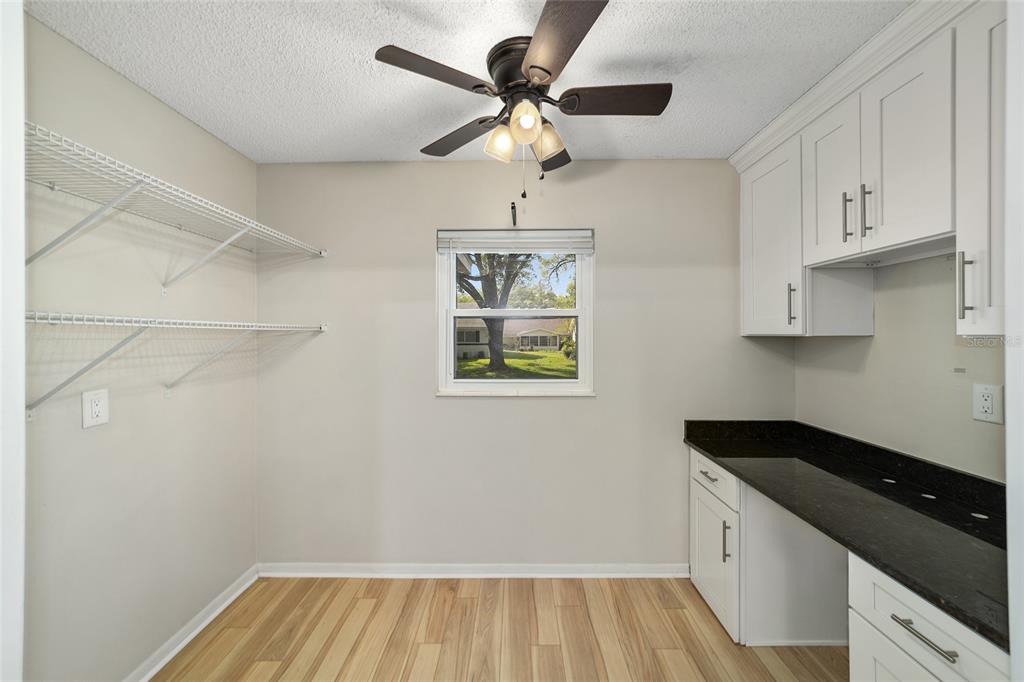 8877 Southwest 96th Street, Unit D Ocala, FL 34481 - Photo 28 of 51 a kitchen with cabinets and window