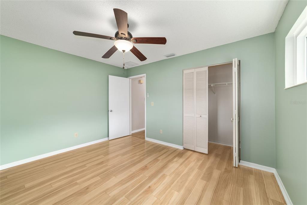 8877 Southwest 96th Street, Unit D Ocala, FL 34481 - Photo 38 of 51 a view of empty room with wooden floor