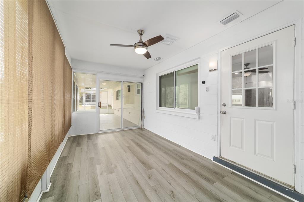 8877 Southwest 96th Street, Unit D Ocala, FL 34481 - Photo 42 of 51 a view of a big room with wooden floor and windows