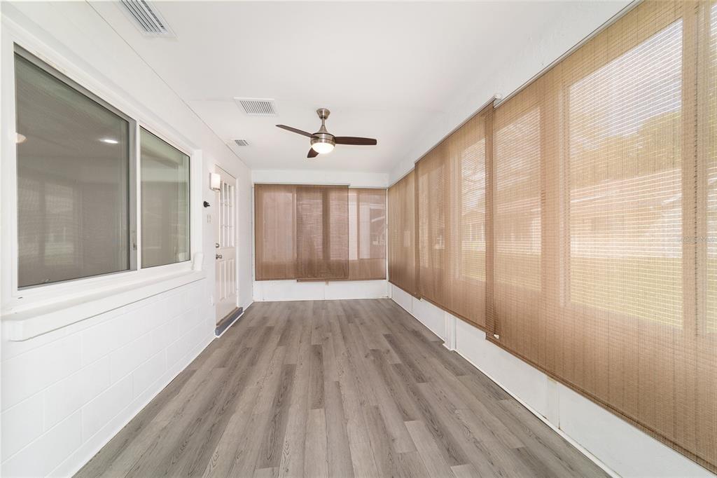 8877 Southwest 96th Street, Unit D Ocala, FL 34481 - Photo 43 of 51 a view of wooden floor and windows in a room