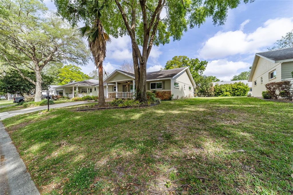 8877 Southwest 96th Street, Unit D Ocala, FL 34481 - Photo 7 of 51 a front view of a house with a garden