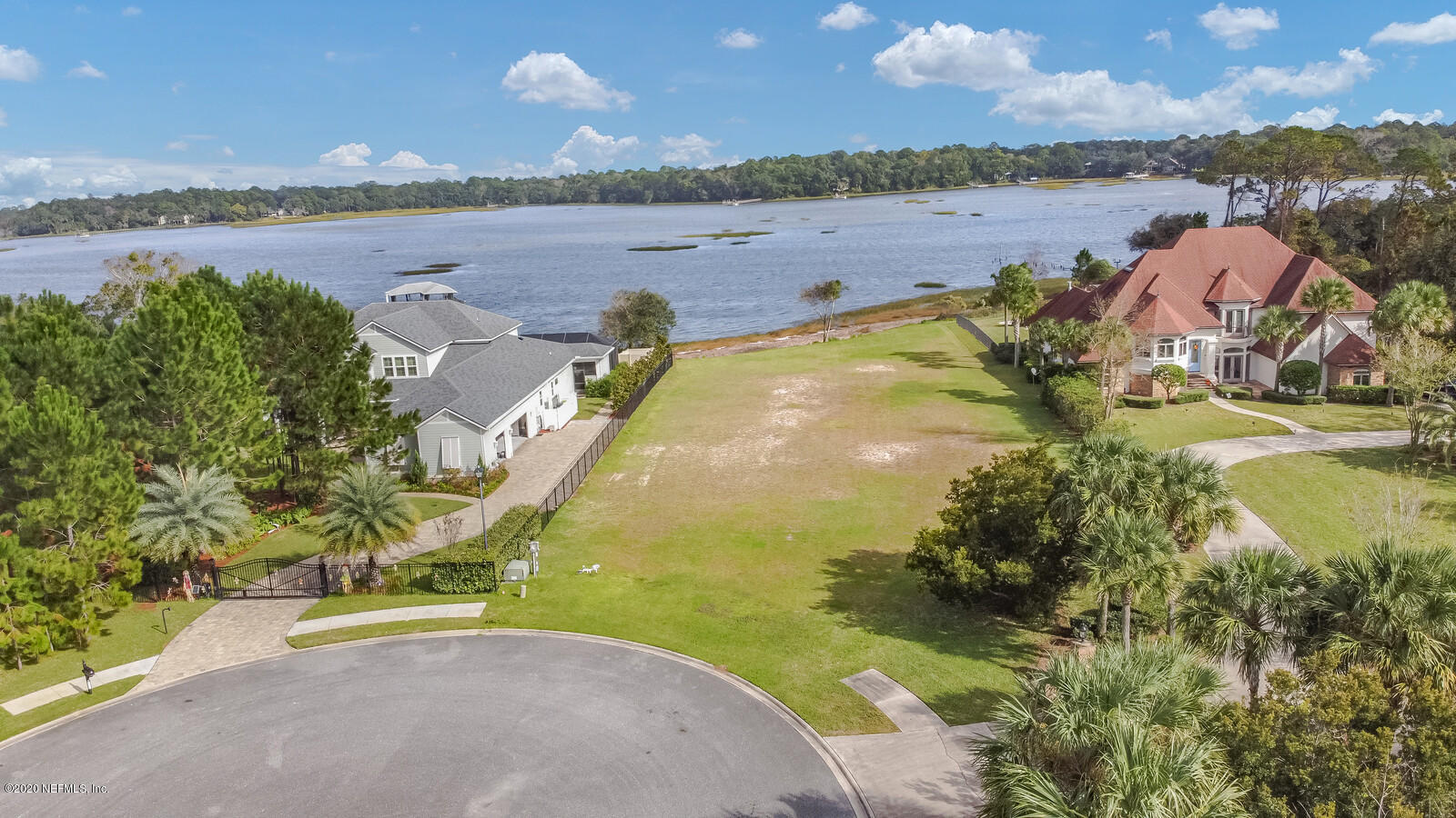 96278 Captains Pointe Road Yulee, FL 32097 - Photo 11 of 17 a view of a lake with a yard