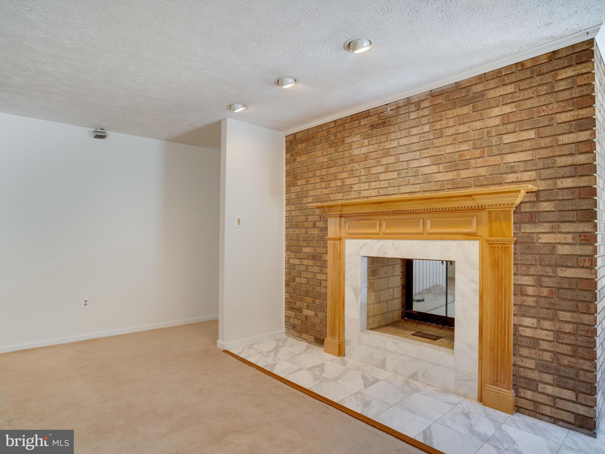 3060 Hickory Ridge Road Dunkirk, MD 20754 - Photo 16 of 29 Family room with two sided wood fireplace