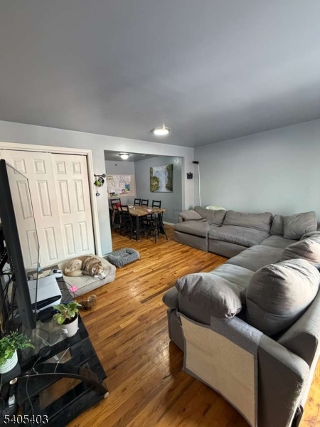 91 Spruce Street Newark, NJ 07102 - Photo 11 of 34 a living room with furniture and a flat screen tv