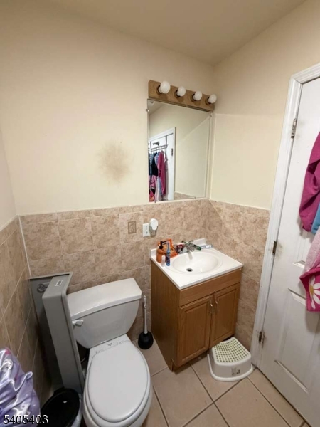 91 Spruce Street Newark, NJ 07102 - Photo 24 of 34 a white toilet sitting next to a bathroom sink