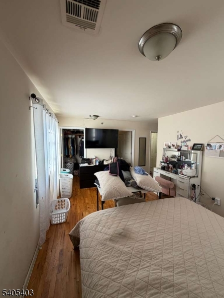 91 Spruce Street Newark, NJ 07102 - Photo 29 of 34 a bedroom with furniture and a window