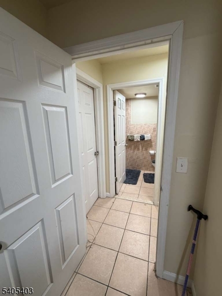 91 Spruce Street Newark, NJ 07102 - Photo 5 of 34 a bedroom with a bed and walk in closet