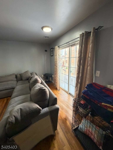 91 Spruce Street Newark, NJ 07102 - Photo 10 of 34 a living room with furniture and a window