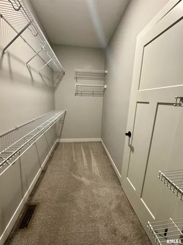 a view of an empty walk in closet