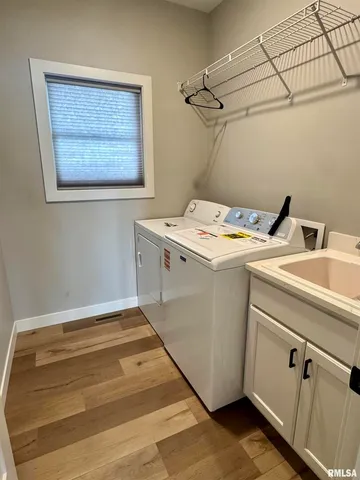 a utility room with dryer and washer