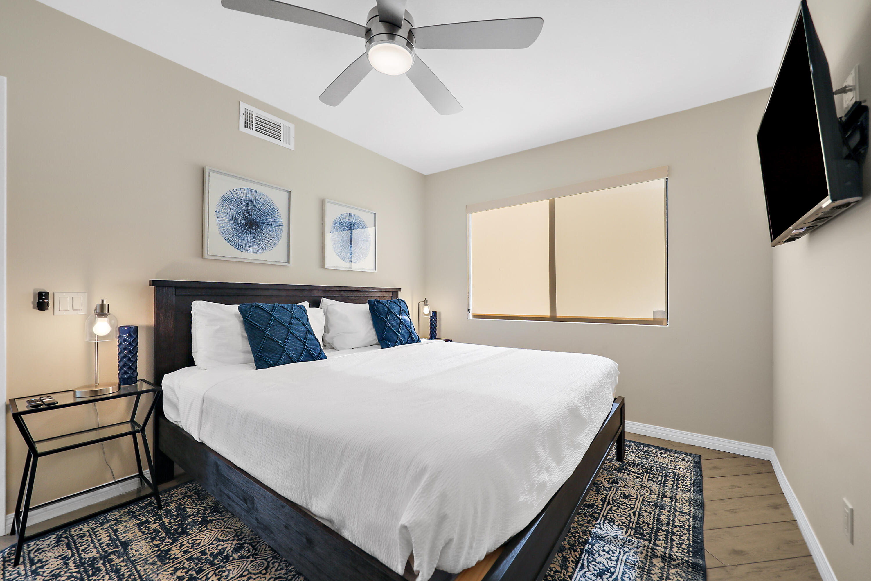 41542 Jupiter Hills Court Palm Desert, CA 92211 - Photo 13 of 29 a bedroom with a bed and a flat screen tv