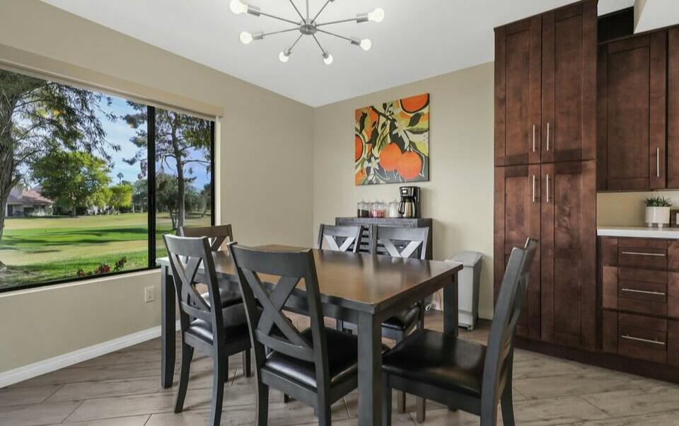 41542 Jupiter Hills Court Palm Desert, CA 92211 - Photo 17 of 29 a view of a dining room with furniture window and outside view