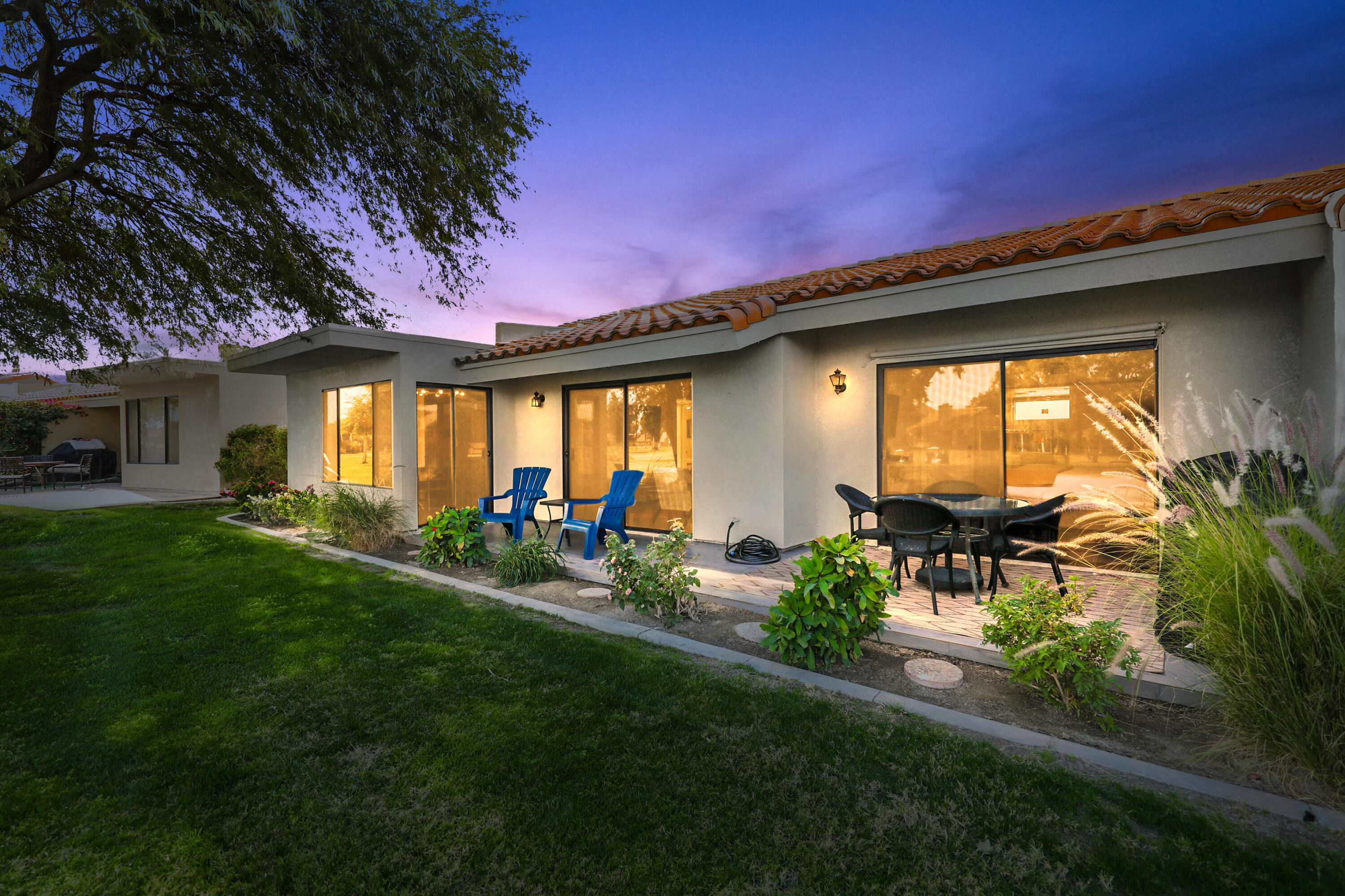 41542 Jupiter Hills Court Palm Desert, CA 92211 - Photo 23 of 29 a front view of a house with a yard