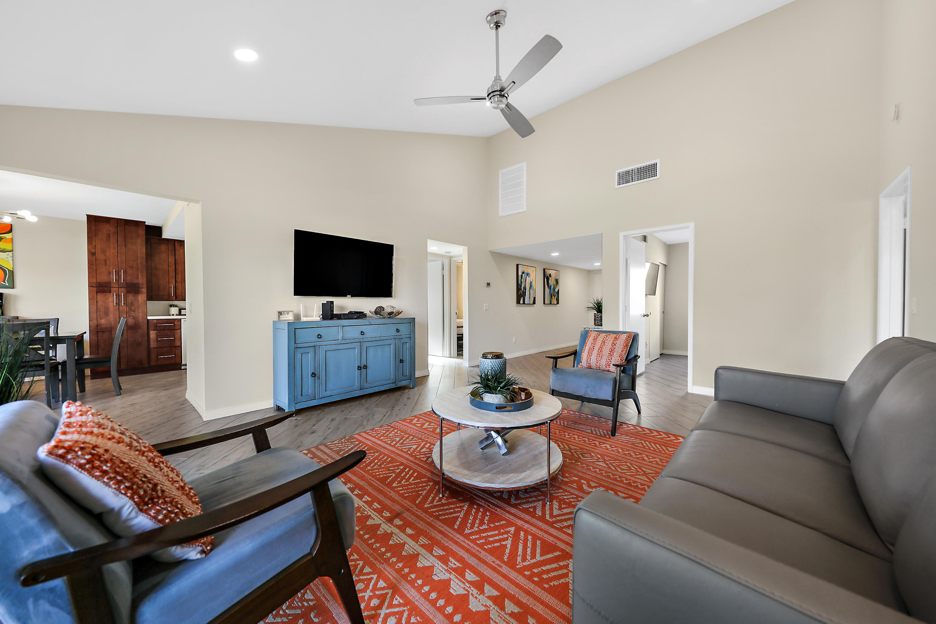 41542 Jupiter Hills Court Palm Desert, CA 92211 - Photo 4 of 29 a living room with furniture and a flat screen tv