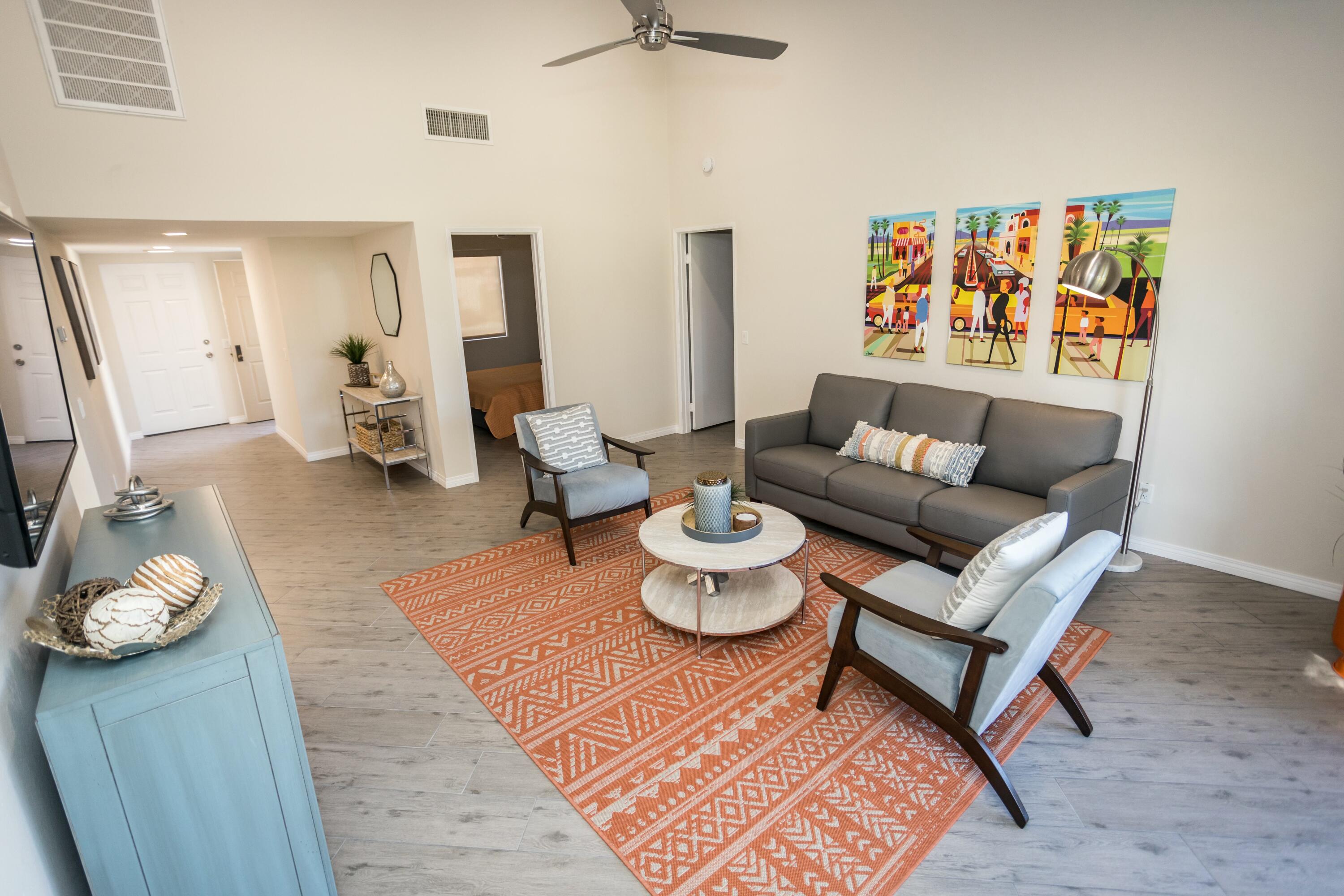 41542 Jupiter Hills Court Palm Desert, CA 92211 - Photo 8 of 29 a living room with furniture and a rug