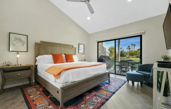 a bed room with a bed and a desk