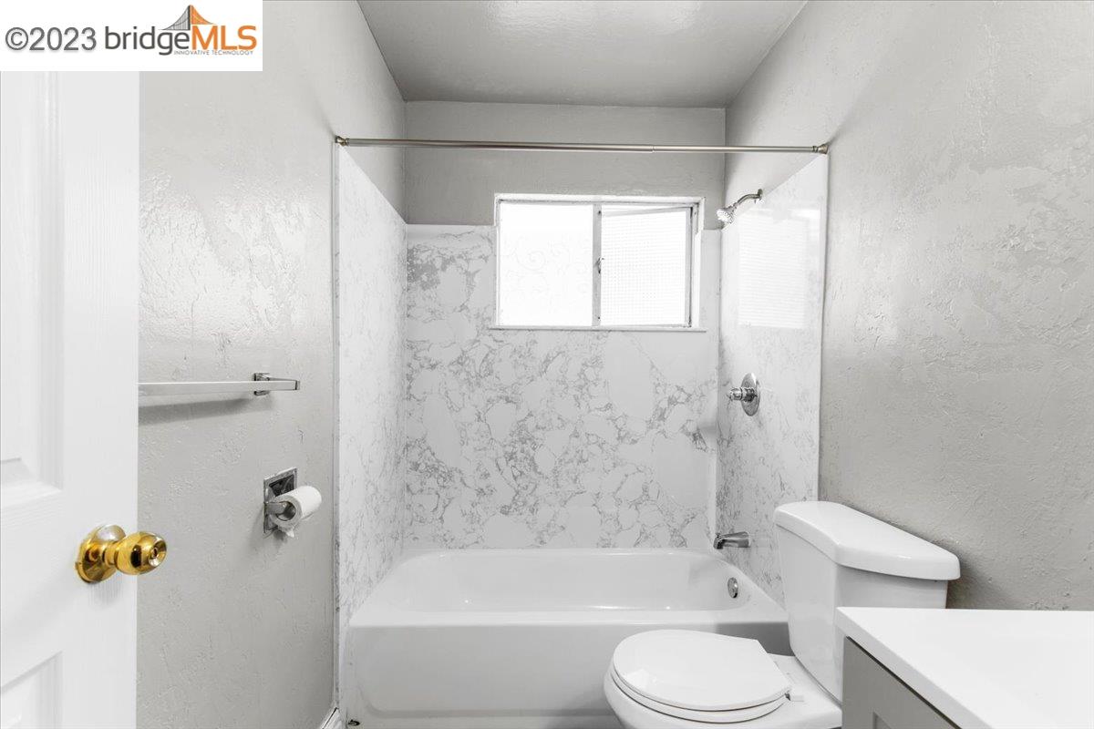 1813 63rd Street, Unit A Berkeley, CA 94703 - Photo 11 of 37 a bathroom with a toilet sink and shower