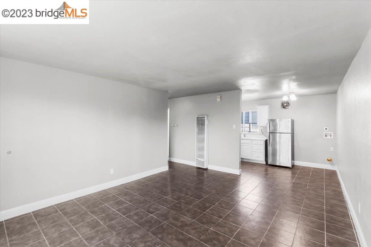 1813 63rd Street, Unit A Berkeley, CA 94703 - Photo 16 of 37 a view of a kitchen with a sink and cabinets