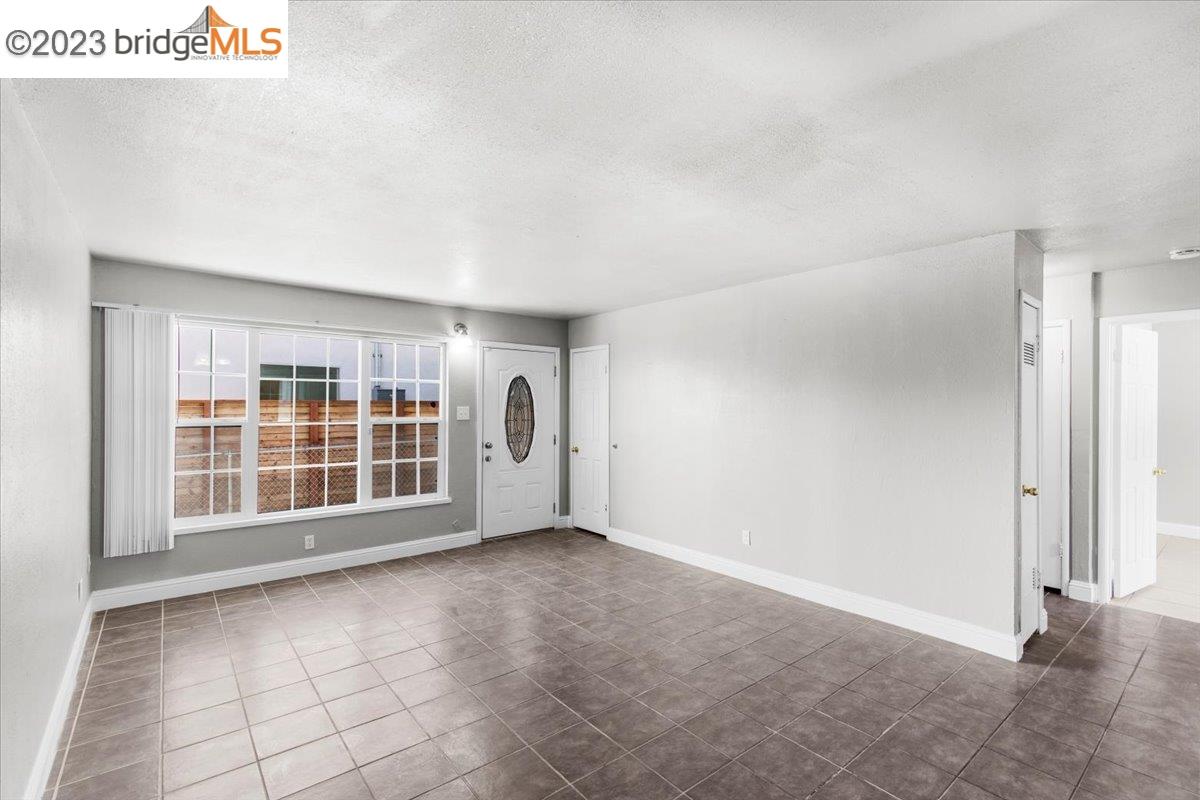 1813 63rd Street, Unit A Berkeley, CA 94703 - Photo 17 of 37 a view of an empty room with a window