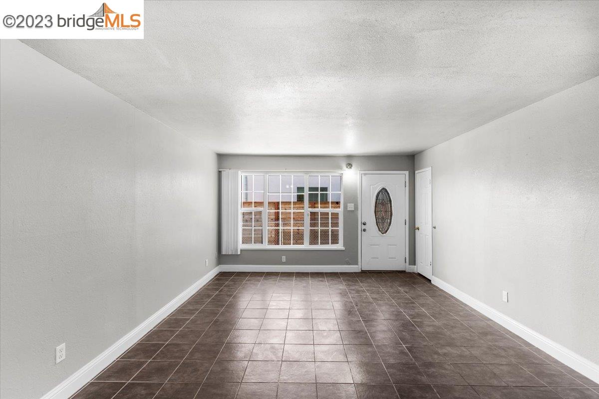 1813 63rd Street, Unit A Berkeley, CA 94703 - Photo 19 of 37 a view of empty room with a window