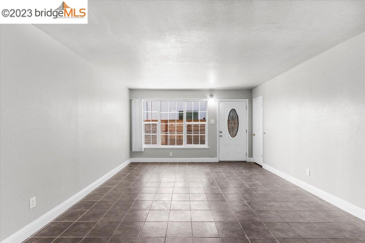 1813 63rd Street, Unit A Berkeley, CA 94703 - Photo 20 of 37 a view of an empty room with a window