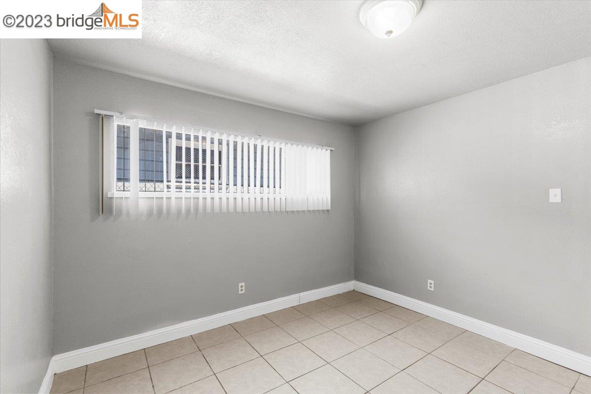 1813 63rd Street, Unit A Berkeley, CA 94703 - Photo 27 of 37 an empty room with a window