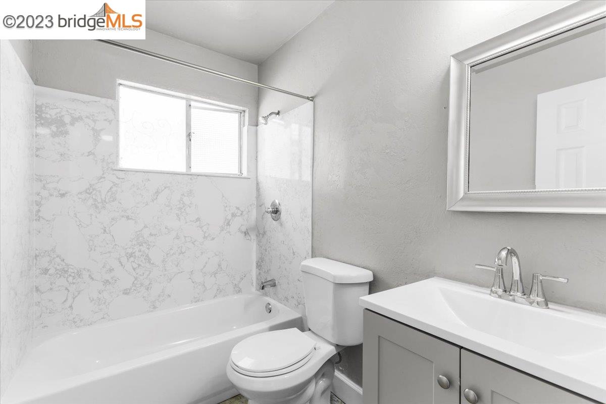 1813 63rd Street, Unit A Berkeley, CA 94703 - Photo 10 of 37 a bathroom with a sink toilet and shower