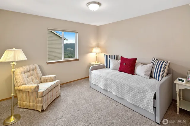 a bedroom with bed and a couch