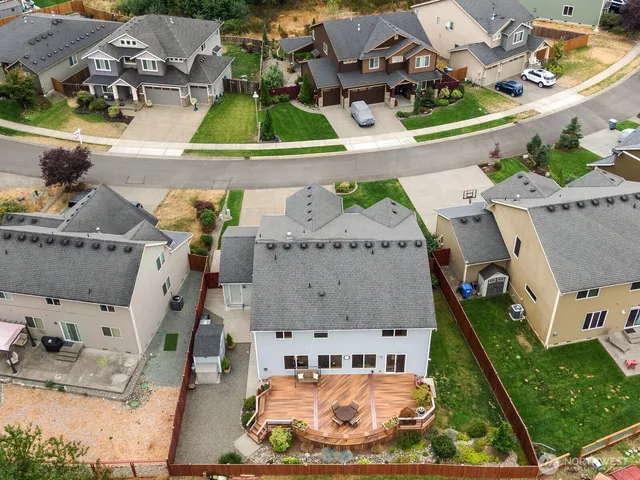 an aerial view of a house with swimming pool