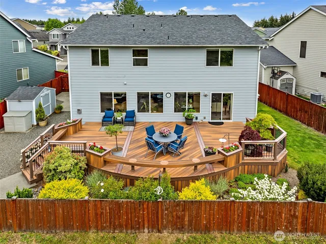 an aerial view of a house with swimming pool garden and patio