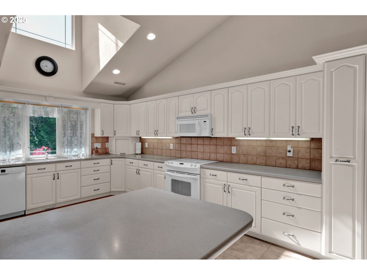 2131 Willow Loop Florence, OR 97439 - Photo 21 of 48 a kitchen with white cabinets stainless steel appliances and sink