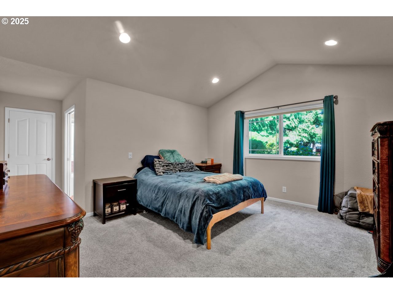 2131 Willow Loop Florence, OR 97439 - Photo 24 of 48 a living room with a bed furniture and a window
