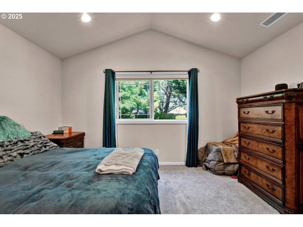 2131 Willow Loop Florence, OR 97439 - Photo 26 of 48 a bedroom with furniture and a window