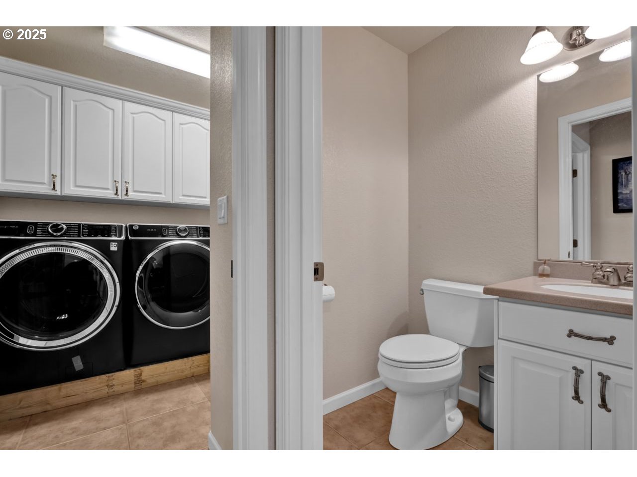 2131 Willow Loop Florence, OR 97439 - Photo 38 of 48 a bathroom with a sink a toilet and a mirror