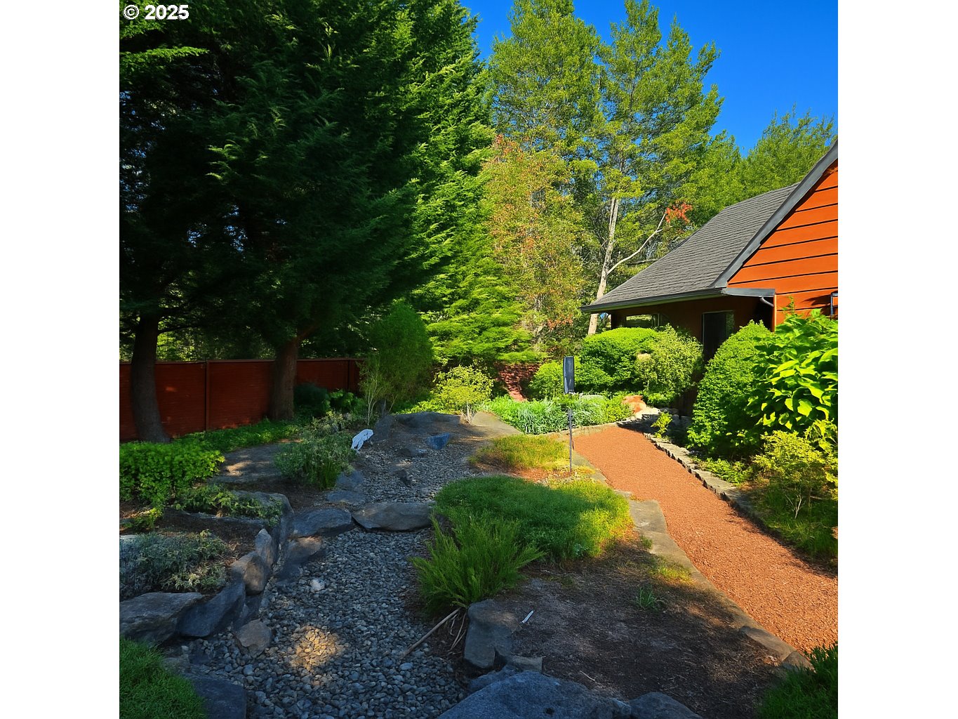 2131 Willow Loop Florence, OR 97439 - Photo 46 of 48 a view of a backyard with plants