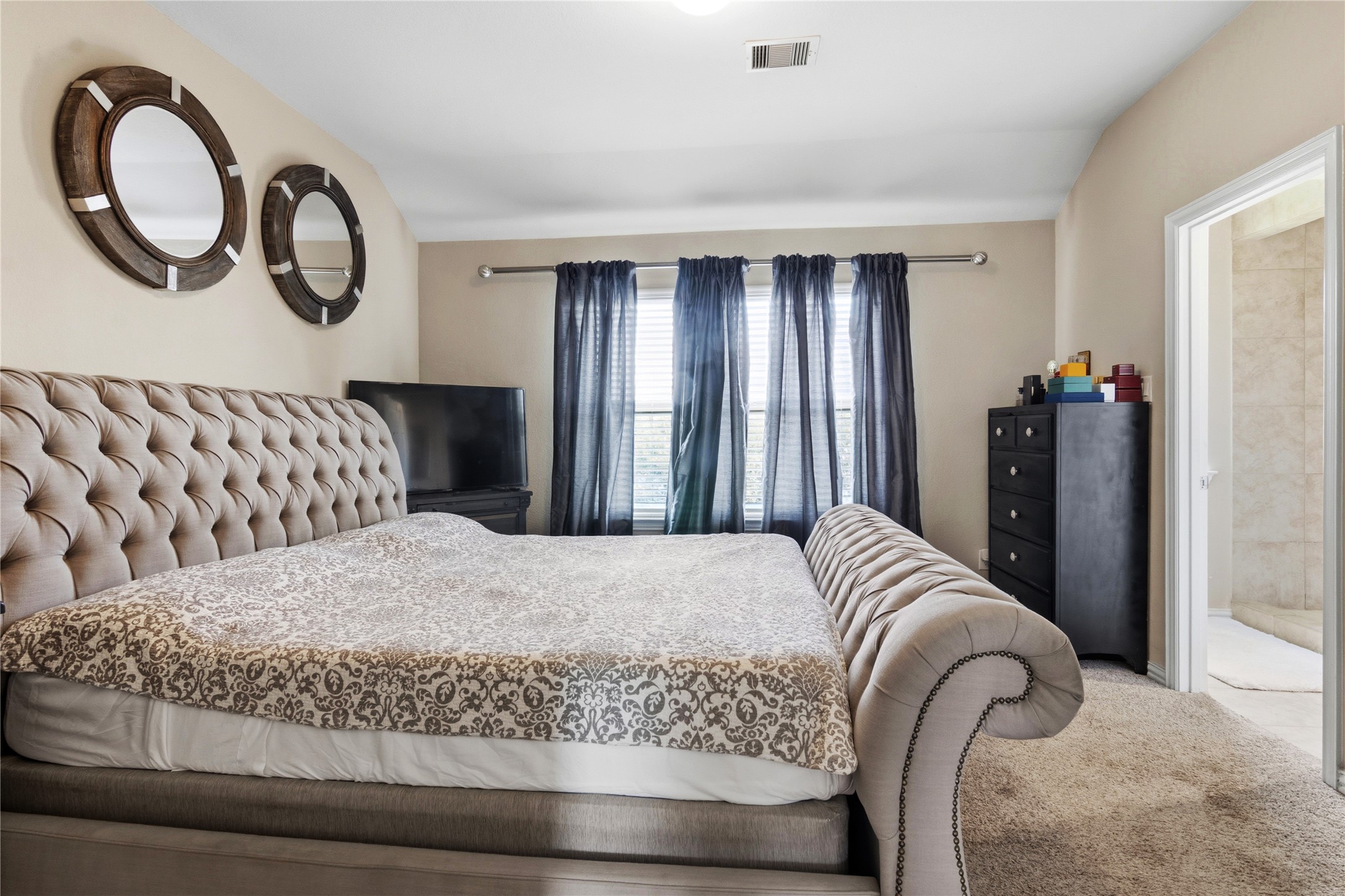 1815 Ryon Falls Drive Richmond, TX 77469 - Photo 13 of 24 a bedroom with a bed and dresser