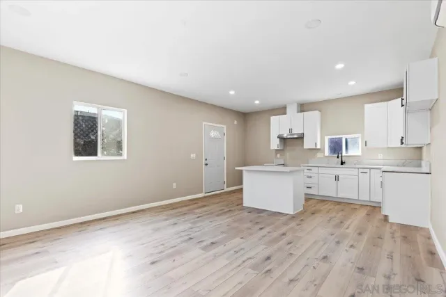 an empty room with wooden floor