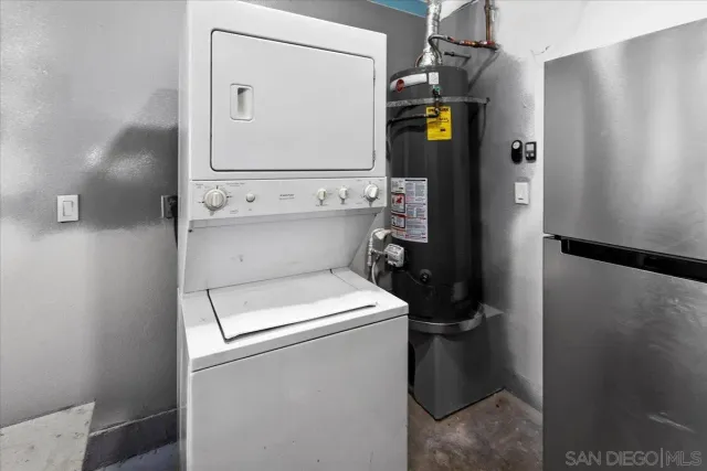 a kitchen with a sink a stove and cabinets