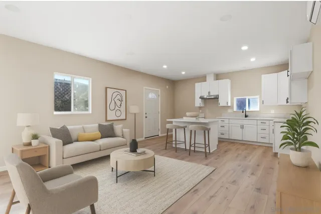 a bedroom with a bed and a potted plant