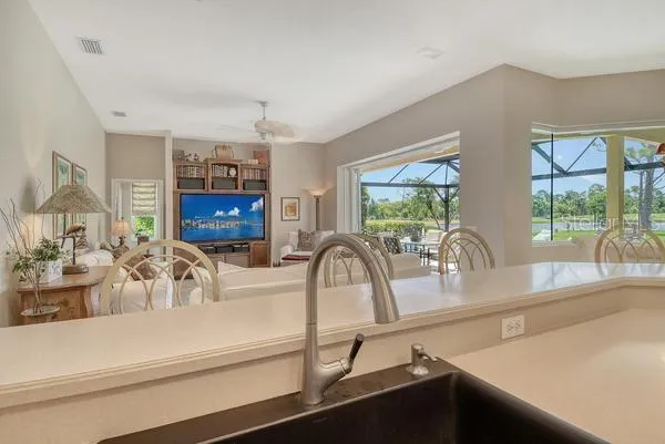 a kitchen with a sink and a large window