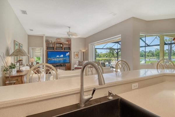 9477 Cedar Ridge Lane Sarasota, FL 34238 - Photo 12 of 51 a kitchen with a sink and a large window