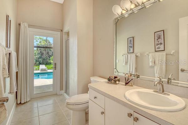 9477 Cedar Ridge Lane Sarasota, FL 34238 - Photo 30 of 51 a bathroom with a sink a toilet and shower