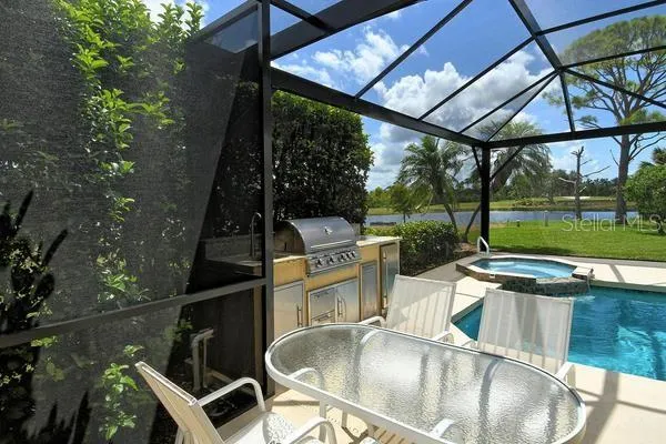 a view of a chairs and table in the patio