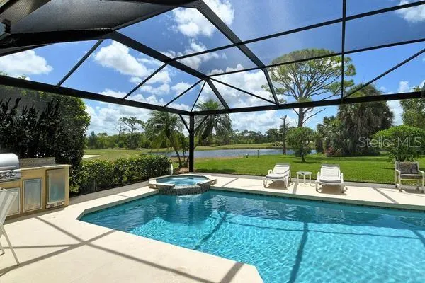 a view of a swimming pool with a patio