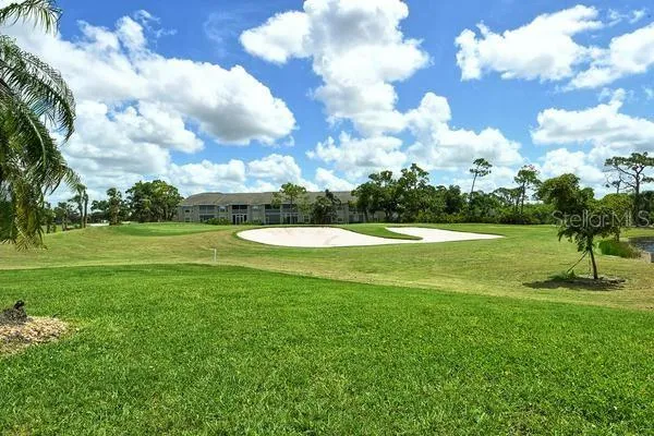 a view of a golf course with a big yard