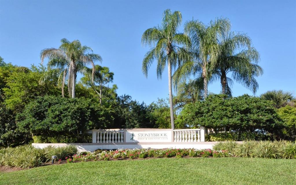 9477 Cedar Ridge Lane Sarasota, FL 34238 - Photo 40 of 51 a view of a park bench and a palm tree