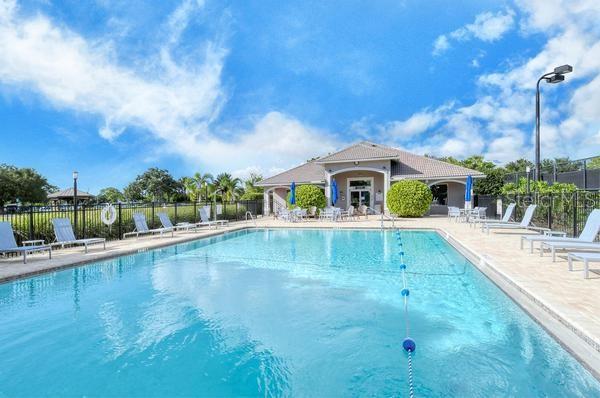 9477 Cedar Ridge Lane Sarasota, FL 34238 - Photo 48 of 51 a front view of house with yard and swimming pool
